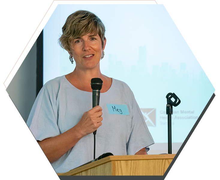 Person speaking at podium with microphone
