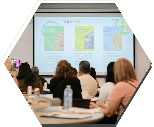 People attending a presentation on toolkits.